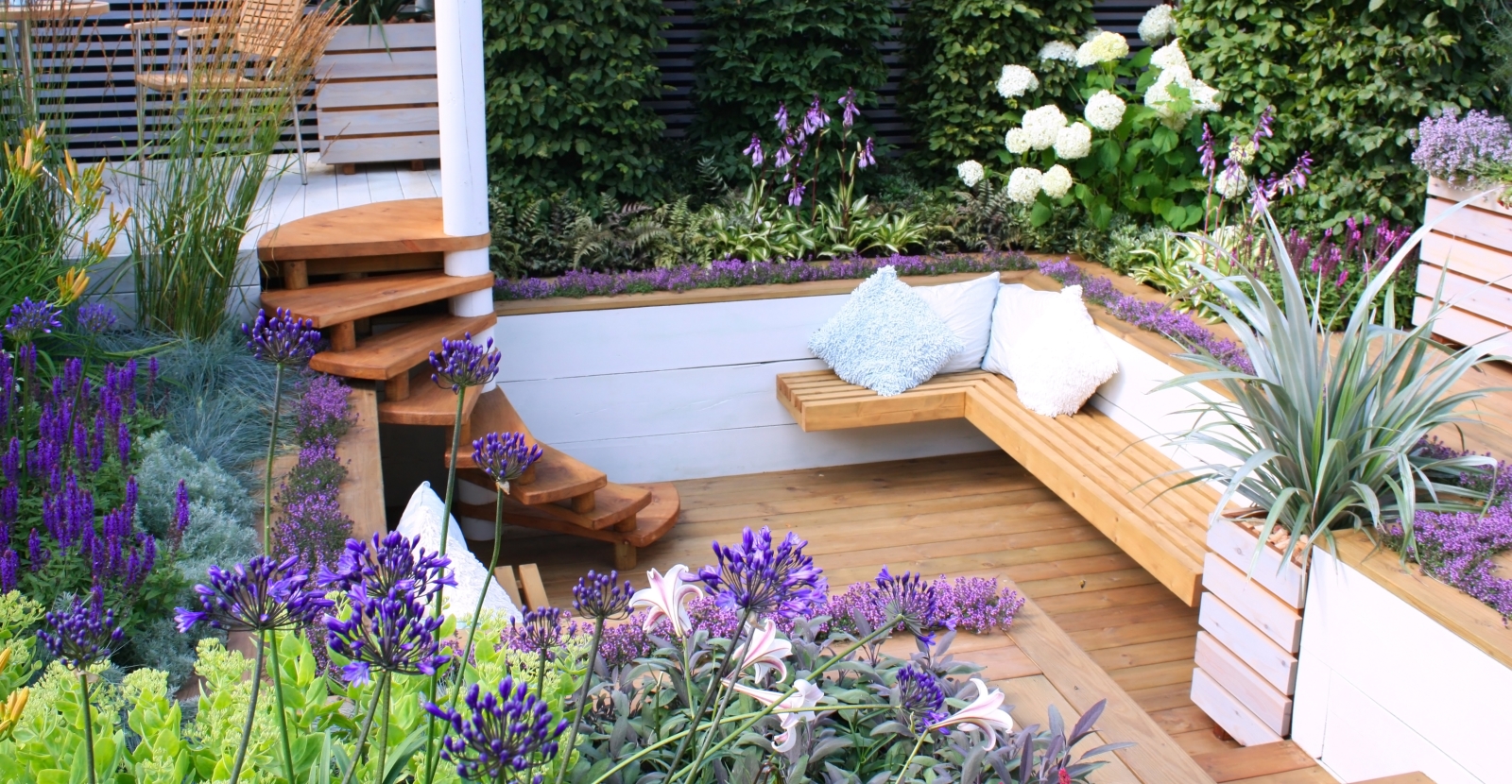 NatureForm landscape designer planning a garden layout with planting ideas